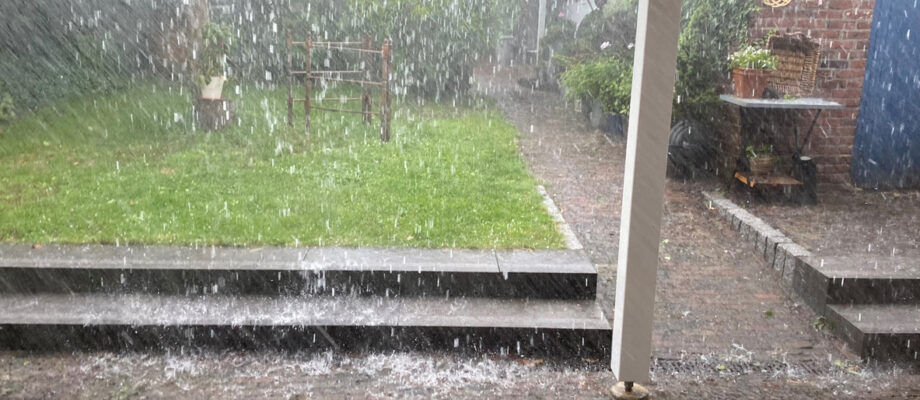 Watching heavy rain after a warm summer day